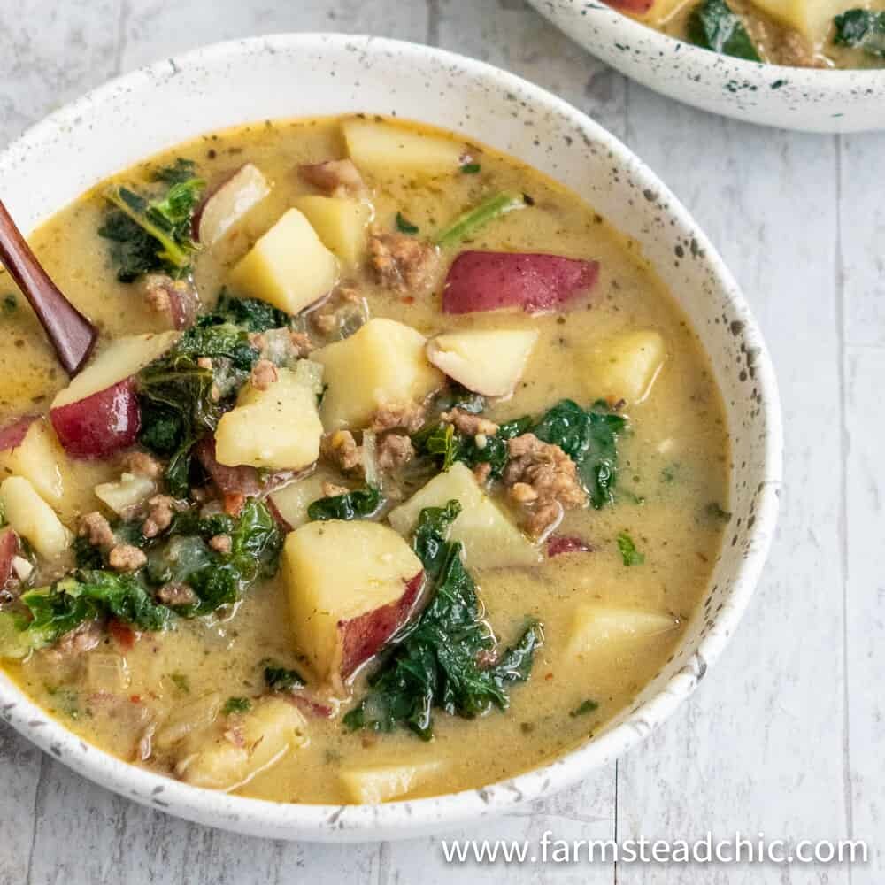 Cozy up to this Whole30 Zuppa Toscana (Dairy-Free Potato Soup Recipe) tonight! Packed with potatoes, sausage and fresh crunchy kale swimming in a lightly spiced broth, you'll think you're at Olive Garden (minus the guilt)! You'll fall in love with this healthy, dairy-free, gluten-free Olive Garden Zuppa Toscana copycat recipe once you give it a try.