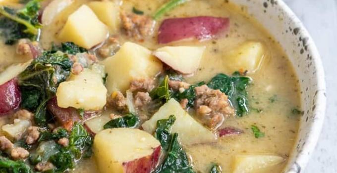 Cozy up to this Whole30 Zuppa Toscana (Dairy-Free Potato Soup Recipe) tonight! Packed with potatoes, sausage and fresh crunchy kale swimming in a lightly spiced broth, you'll think you're at Olive Garden (minus the guilt)! You'll fall in love with this healthy, dairy-free, gluten-free Olive Garden Zuppa Toscana copycat recipe once you give it a try.