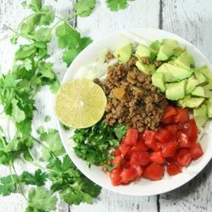 These Whole30 and Paleo compliant Taco Salad Bowls are a healthy, quick and easy, fresh and flavorful, completely customizable weeknight meal fit for the whole family!