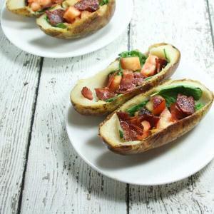 These BLT Whole30 Potato Skins are slathered with ghee and stuffed with spinach, tomatoes and bacon!