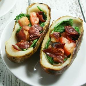 These BLT Whole30 Potato Skins are slathered with ghee and stuffed with spinach, tomatoes and bacon!