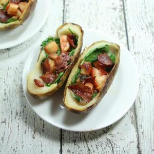 These BLT Whole30 Potato Skins are slathered with ghee and stuffed with spinach, tomatoes and bacon!