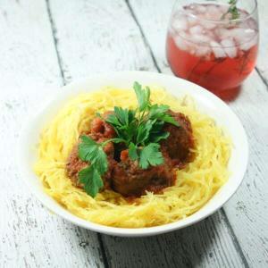 These giant-sized Paleo & Whole30 Italian Meatballs with Spaghetti Squash are tasty, healthy and easy to make in the slow cooker for a fuss-free dinner!