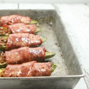 Beefy, creamy, wrapped in bacon and easy to make, these Paleo and Whole30 Jalapeño Poppers are the perfect Super Bowl party snack!