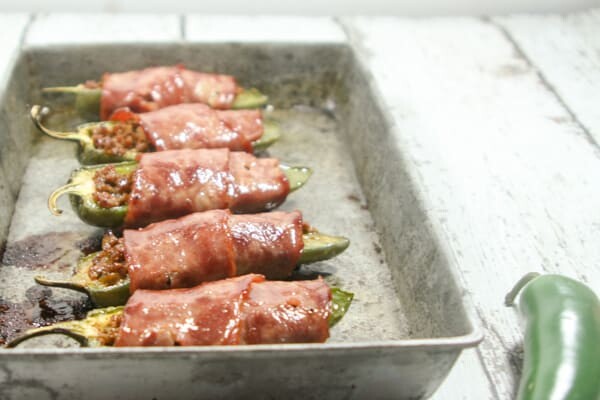 Beefy, creamy, wrapped in bacon and easy to make, these Paleo and Whole30 Jalapeño Poppers are the perfect Super Bowl party snack!