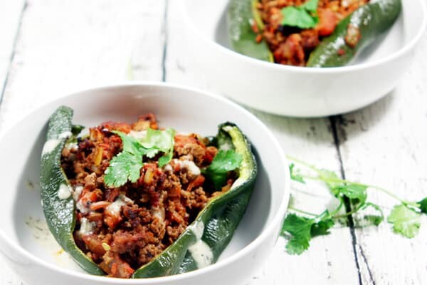 These Paleo and Whole30 Stuffed Poblano Peppers are completely freakin' out of this world delicious, a no-brainer to make, and healthy to boot.