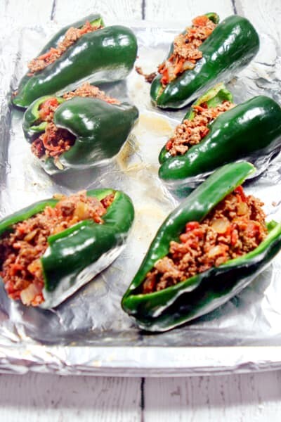 These Paleo and Whole30 Stuffed Poblano Peppers are completely freakin' out of this world delicious, a no-brainer to make, and healthy to boot.