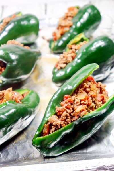 These Paleo and Whole30 Stuffed Poblano Peppers are completely freakin' out of this world delicious, a no-brainer to make, and healthy to boot.