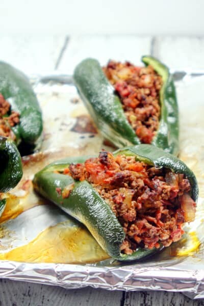 These Paleo and Whole30 Stuffed Poblano Peppers are completely freakin' out of this world delicious, a no-brainer to make, and healthy to boot.