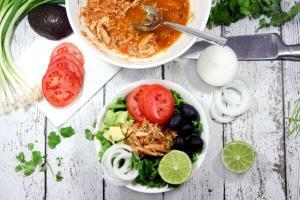 Just toss these 4 ingredients (+S&P) in the slow cooker for an easy weeknight meal! This Paleo + Whole30 Pineapple Salsa Chicken will make dinner a breeze.