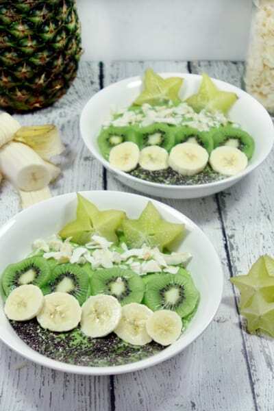 These Paleo and Whole30 Tropical Avocado Smoothie Bowls are on point. Smooth and creamy, they're the perfect detox breakfast after a weekend of cheat meals. 