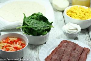 These Bacon and Egg Breakfast Burritos are rolls of ooey-gooey cheesiness + buttery crispiness and are easily altered to fit a Whole30 / Paleo lifestyle!