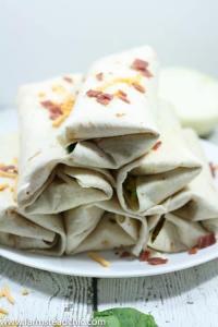 These Bacon and Egg Breakfast Burritos are rolls of ooey-gooey cheesiness + buttery crispiness and are easily altered to fit a Whole30 / Paleo lifestyle!