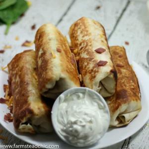 These Bacon and Egg Breakfast Burritos are rolls of ooey-gooey cheesiness + buttery crispiness and are easily altered to fit a Whole30 / Paleo lifestyle!