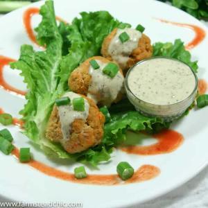 These Paleo and Whole30 Buffalo Chicken Meatballs are the perfect combo of spice + tang + meaty deliciousness. Wrap in gorgeous green lettuce leaves & drizzle with Whole30-approved ranch dressing. You'd never know they are good for you!