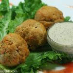 These Paleo and Whole30 Buffalo Chicken Meatballs are the perfect combo of spice + tang + meaty deliciousness. Wrap in gorgeous green lettuce leaves & drizzle with Whole30-approved ranch dressing. You'd never know they are good for you!