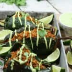 These Chipotle Lime Chicken Stuffed Poblano Peppers are a Mexican fiesta in your mouth. The spicy ground chipotle, slightly sweet + tangy lime juice and smoky poblanos create a mouthwatering combo. Did I mention they are Paleo and Whole30-compliant?