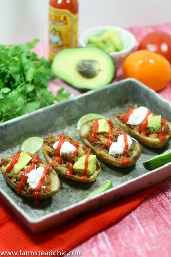 These Whole30 Beefy Taco Potato Skins are crispy and buttery, filled with savory taco meat, tomatoes + onions with an endless array of toppings. Dairy-free!