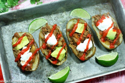 These Whole30 Beefy Taco Potato Skins are crispy and buttery, filled with savory taco meat, tomatoes + onions with an endless array of toppings. Dairy-free!