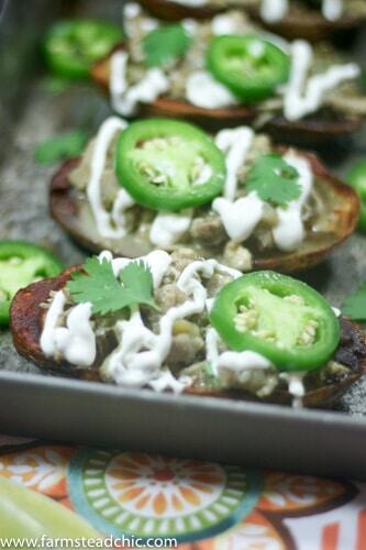 These Whole30 White Chicken Chili Potato Skins are the perfect blend of savory, spicy white chicken chili spooned into salty, crispy, buttery potato skins. Gluten free + dairy free and full of healthy goodness.