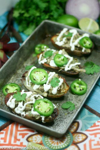 These Whole30 White Chicken Chili Potato Skins are the perfect blend of savory, spicy white chicken chili spooned into salty, crispy, buttery potato skins. Gluten free + dairy free and full of healthy goodness.