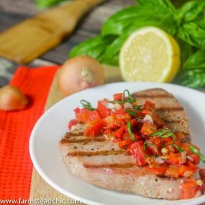 This Paleo and Whole30 Grilled Ahi Tuna with Roasted Red Pepper Relish is super simple to make but bursting with flavor.  With ingredients like jarred roasted red peppers, lemon juice, thyme and fresh basil, it's the perfect healthy (20 minute) grilled summer dinner!