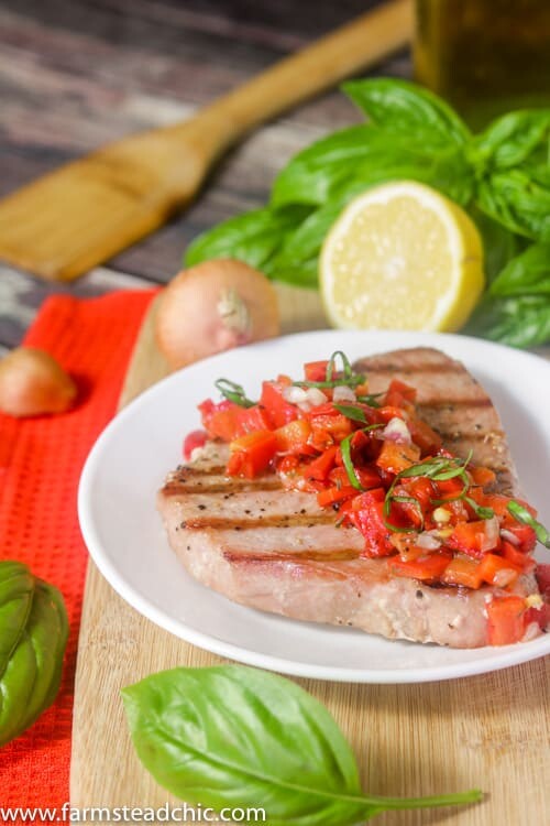 This Paleo and Whole30 Grilled Ahi Tuna with Roasted Red Pepper Relish is super simple to make but bursting with flavor.  With ingredients like jarred roasted red peppers, lemon juice, thyme and fresh basil, it's the perfect healthy (20 minute) grilled summer dinner!