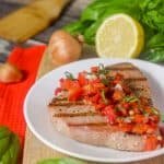 This Paleo and Whole30 Grilled Ahi Tuna with Roasted Red Pepper Relish is super simple to make but bursting with flavor.  With ingredients like jarred roasted red peppers, lemon juice, thyme and fresh basil, it's the perfect healthy (20 minute) grilled summer dinner!