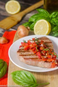 This Paleo and Whole30 Grilled Ahi Tuna with Roasted Red Pepper Relish is super simple to make but bursting with flavor. With ingredients like jarred roasted red peppers, lemon juice, thyme and fresh basil, it's the perfect healthy (20 minute) grilled summer dinner!