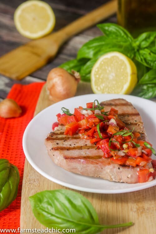 This Paleo and Whole30 Grilled Ahi Tuna with Roasted Red Pepper Relish is super simple to make but bursting with flavor.  With ingredients like jarred roasted red peppers, lemon juice, thyme and fresh basil, it's the perfect healthy (20 minute) grilled summer dinner!