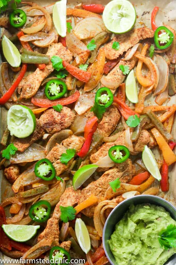 This Paleo and Whole30 Chicken Fajitas Sheet Pan Dinner is simple and easy with minimal cleanup! Serve it with some lime wedges, cilantro and guacamole.