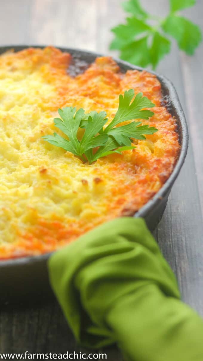 This Whole30 Shepherd's Pie is packed full of savory flavors like thyme and rosemary. Lamb meat is topped with fluffy, buttery mashed potatoes toasted to perfection under the broiler. Dairy free and gluten free. Use ground beef for a Whole30 Cottage Pie instead.