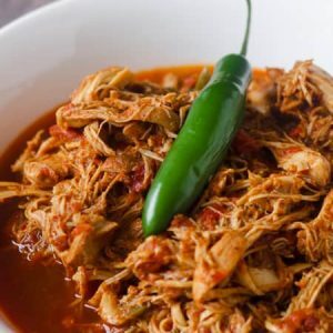This Paleo and Whole30 Instant Pot Taco Chicken is packed full of flavor with fresh red Anaheim and Serrano peppers along with chili powder and chipotle powder. Coriander, cumin and garlic and onion powder bring everything into balance and pack a nutritional punch as well. Low carb, Keto-friendly, gluten free, grain free, dairy free. Serve onto Whole30-compliant wraps, a bed of leafy greens or a baked sweet potato.