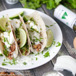 low carb keto chorizo breakfast tacos with cotija cheese, sour cream and cilantro