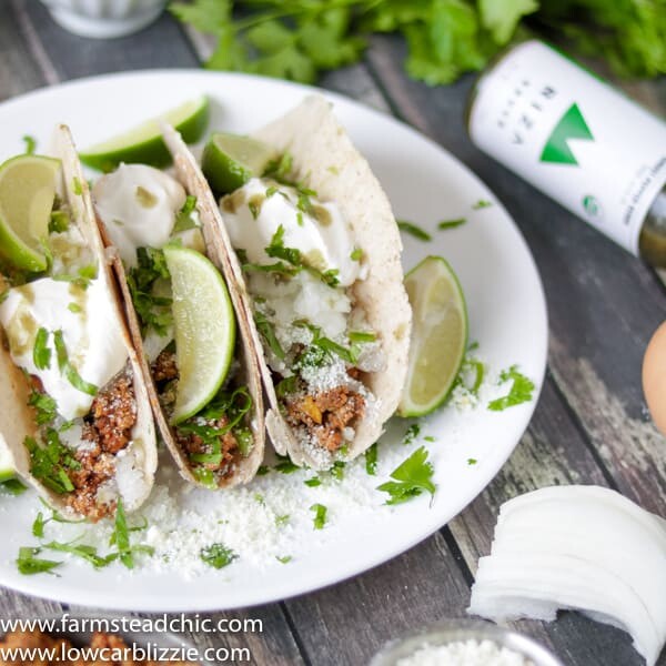 low carb keto chorizo breakfast tacos with cotija cheese, sour cream and cilantro