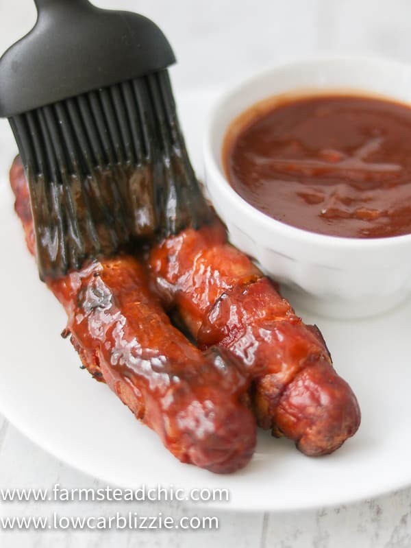 These Low Carb, Keto BBQ Bacon-Wrapped Hot Dogs are sure to be a hit with everyone, especially the kiddos. Who can say no to a grilled hot dog wrapped in bacon and slathered with a sweet and spicy (if you want) barbecue sauce? You only need three ingredients, ten minutes and a grill to get these puppies started. Come on! 