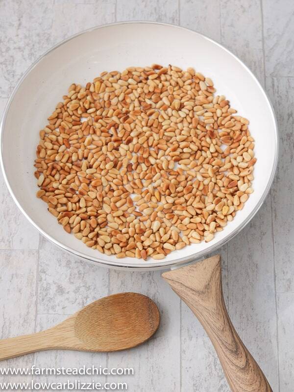 How to toast pine nuts! This super-quick, super-easy instructional post on how to toast pine nuts will bring your dreams of homemade keto pesto to life. All you need is a frying pan, a wooded spoon, and well, pine nuts! 