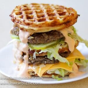 The perfect Chaffle bun, super thin, juicy, perfectly seasoned hamburger patty, crunchy dill pickles, shredded iceberg lettuce, American cheese and Thousand Island dressing make this Keto Big Mac Chaffle taste like the real thing without all the harmful additives and questionable ingredients.  #ketobigmac #bigmacchaffle #lowcarbbigmac #lowcarbburger #chaffle #farmsteadchic 