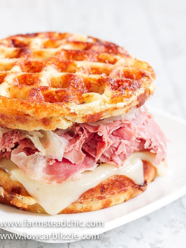 The perfect Chaffle bread, shaved corn beef, juicy sauerkraut, crunchy dill pickles, melty Swiss cheese and Thousand Island dressing make this Keto Reuben Chaffle taste better than the real thing without all the harmful additives and questionable ingredients.  #ketoreuben #reubenchaffle #lowcarbreuben #lowcarbsandwich #chaffle #farmsteadchic 