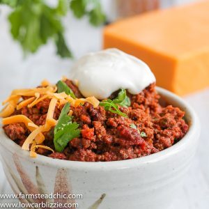 This Low Carb, Keto Chili uses only nine simple ingredients you probably already have in your kitchen. It's healthy, easy to make and a hit with the kids too! #ketochili #lowcarbchili #beanlesschili #farmsteadchic