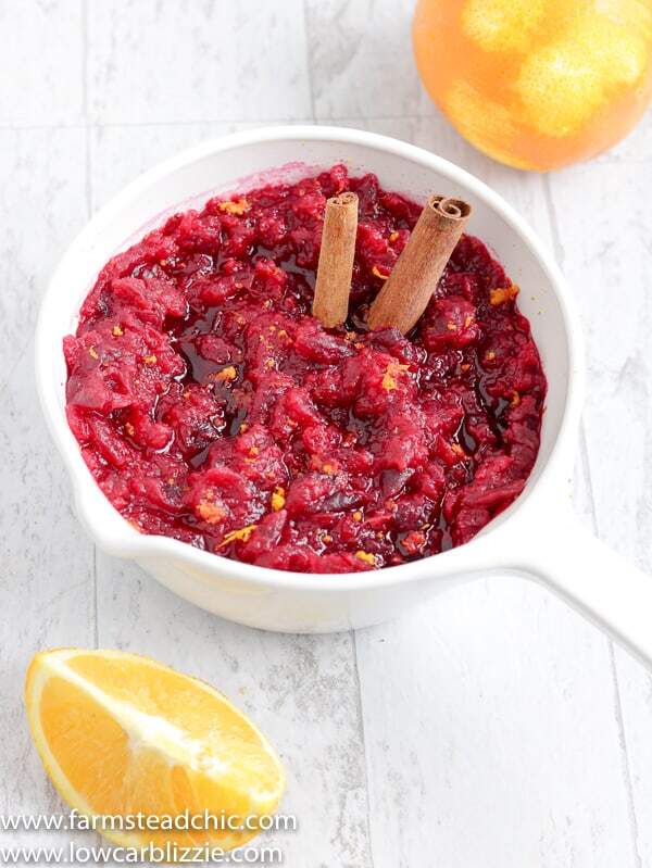This Low Carb, Keto Cranberry Sauce has a citrus-cinnamon twist and is the perfect complement to your holiday spread. Fresh orange zest and orange extract replace the sugary orange juice found in most cranberry-orange sauces, and a monk fruit blend brings plenty of sweetness without all of those carbs.  #farmsteadchic #cranberrysauce #ketocranberrysauce #lowcarbcranberrysauce #ketoholiday #lowcarbholiday #thanksgivingrecipes #Christmasrecipes #ketothanksgivingrecipes #ketoChristmasrecipes #lowcarbthanksgivingrecipes #lowcarbChristmasrecipes 