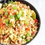 With this Low Carb, Keto Ham Fried Rice (Fried Cauliflower Rice), you can have your takeout and stay low carb too! Freshly riced cauliflower replaces traditional rice, and bell peppers add sweet and savory flavors plus crunch without all the carbs the usual takeout fried rice veggies have. Freshly grated ginger and minced garlic take the whole dish to the next level.  #farmsteadchic #CliftyFarm #countryham #southerncooking #ketofriedrice #lowcarbfriedrice #hamfriedrice