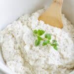 These Low Carb, Keto Mashed Cauliflower Fauxtatoes are super creamy and flavored with plenty of butter, thyme, oregano and garlic. Enjoy them at your next holiday gathering or summer BBQ. They taste like the best-ever garlic herb mashed potatoes with only a fraction of the carbs! #farmsteadchic #ketopotatoes #keto #lowcarb #lowcarbpotatoes #mashedpotatoes #mashedfauxtatoes #fauxtatoes #holidaysidedish #holidaysidedishes #ketosidedish #lowcarbsidedish