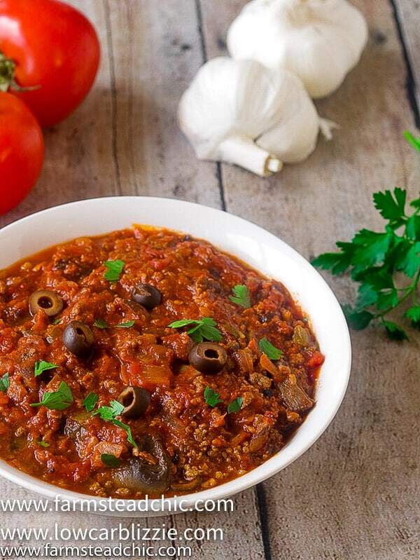 This Low Carb, Keto Pizza Soup with a Whole30 and Paleo option is the perfect warm and cozy meal for a chilly fall evening. With onions, green bell pepper, mushrooms, olives, marinara sauce and plenty of meat, it will satisfy your pizza craving without all the time and effort of those low carb pizza crusts. | www.farmsteadchic.com | #farmsteadchic #ketosoup #lowcarbsoup #ketopizza #lowcarbpizza #pizzasoup