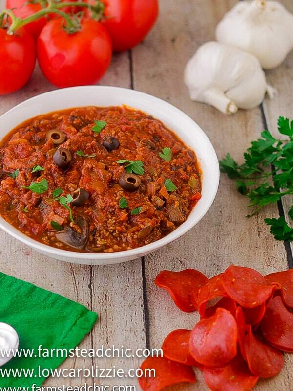 This Low Carb, Keto Pizza Soup with a Whole30 and Paleo option is the perfect warm and cozy meal for a chilly fall evening. With onions, green bell pepper, mushrooms, olives, marinara sauce and plenty of meat, it will satisfy your pizza craving without all the time and effort of those low carb pizza crusts. | www.farmsteadchic.com | #farmsteadchic #ketosoup #lowcarbsoup #ketopizza #lowcarbpizza #pizzasoup