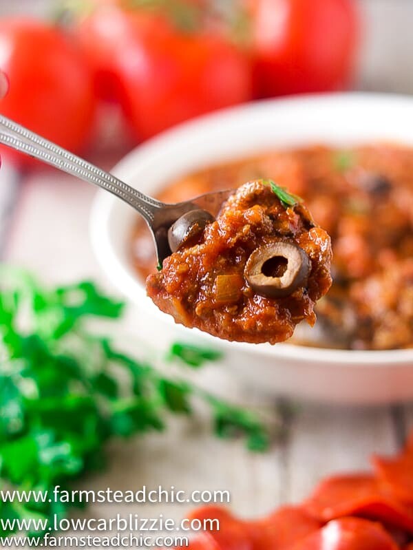 This Low Carb, Keto Pizza Soup with a Whole30 and Paleo option is the perfect warm and cozy meal for a chilly fall evening. With onions, green bell pepper, mushrooms, olives, marinara sauce and plenty of meat, it will satisfy your pizza craving without all the time and effort of those low carb pizza crusts. | www.farmsteadchic.com | #farmsteadchic #ketosoup #lowcarbsoup #ketopizza #lowcarbpizza #pizzasoup