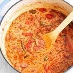 This Low Carb, Keto Sausage and Peppers Soup is full of so many fresh flavors! Crispy-browned beef kielbasa, sweet red and green bell peppers and savory onions simmer in a chicken and tomato-based broth. Freshly minced garlic and Italian seasoning provide plenty of favor, and heavy cream balances out the spiciness of crushed red pepper. #farmsteadchic #lowcarbsoup #ketosoup #sausageandpeppers #creamysoup #kielbasa #sausagesoup