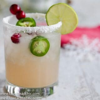 This Low Carb, Keto Spicy Cranberry Margarita is the perfect guilt-free holiday cocktail! Fresh cranberries and jalapeños add a special twist to the traditional margarita. Orange extract and a little water replace the traditional sugar-laden orange liqueur. | www.farmsteadchic.com #ketococktail #lowcarbcocktail #ketomargarita #lowcarbmargarita #spicymargarita #holidaymargarita #Christmascocktail