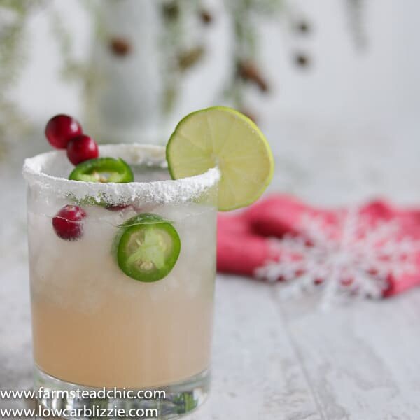 This Low Carb, Keto Spicy Cranberry Margarita is the perfect guilt-free holiday cocktail! Fresh cranberries and jalapeños add a special twist to the traditional margarita. Orange extract and a little water replace the traditional sugar-laden orange liqueur. | www.farmsteadchic.com #ketococktail #lowcarbcocktail #ketomargarita #lowcarbmargarita #spicymargarita #holidaymargarita #Christmascocktail