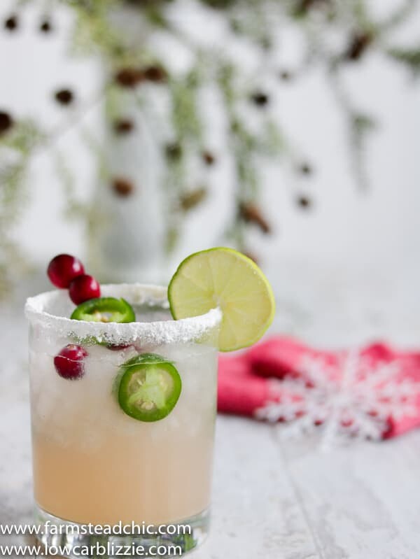 This Low Carb, Keto Spicy Cranberry Margarita is the perfect guilt-free holiday cocktail! Fresh cranberries and jalapeños add a special twist to the traditional margarita. Orange extract and a little water replace the traditional sugar-laden orange liqueur. | www.farmsteadchic.com #ketococktail #lowcarbcocktail #ketomargarita #lowcarbmargarita #spicymargarita #holidaymargarita #Christmascocktail